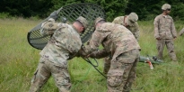 Soldiers setting up a microwave communication system. 