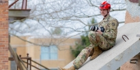 Soldier preparing to capture images of a training event. 