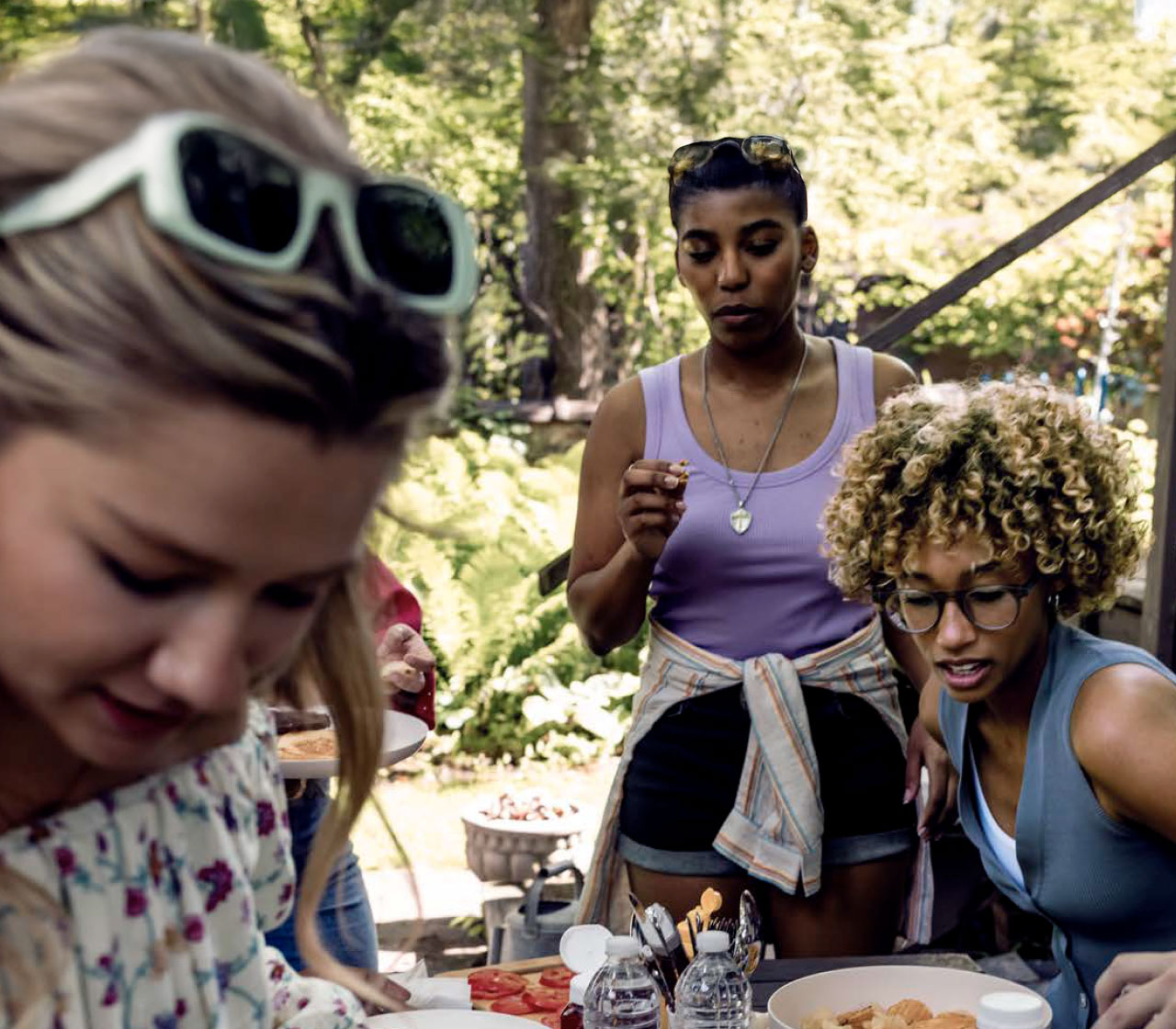 Group of people sitting at a table and sharing a meal