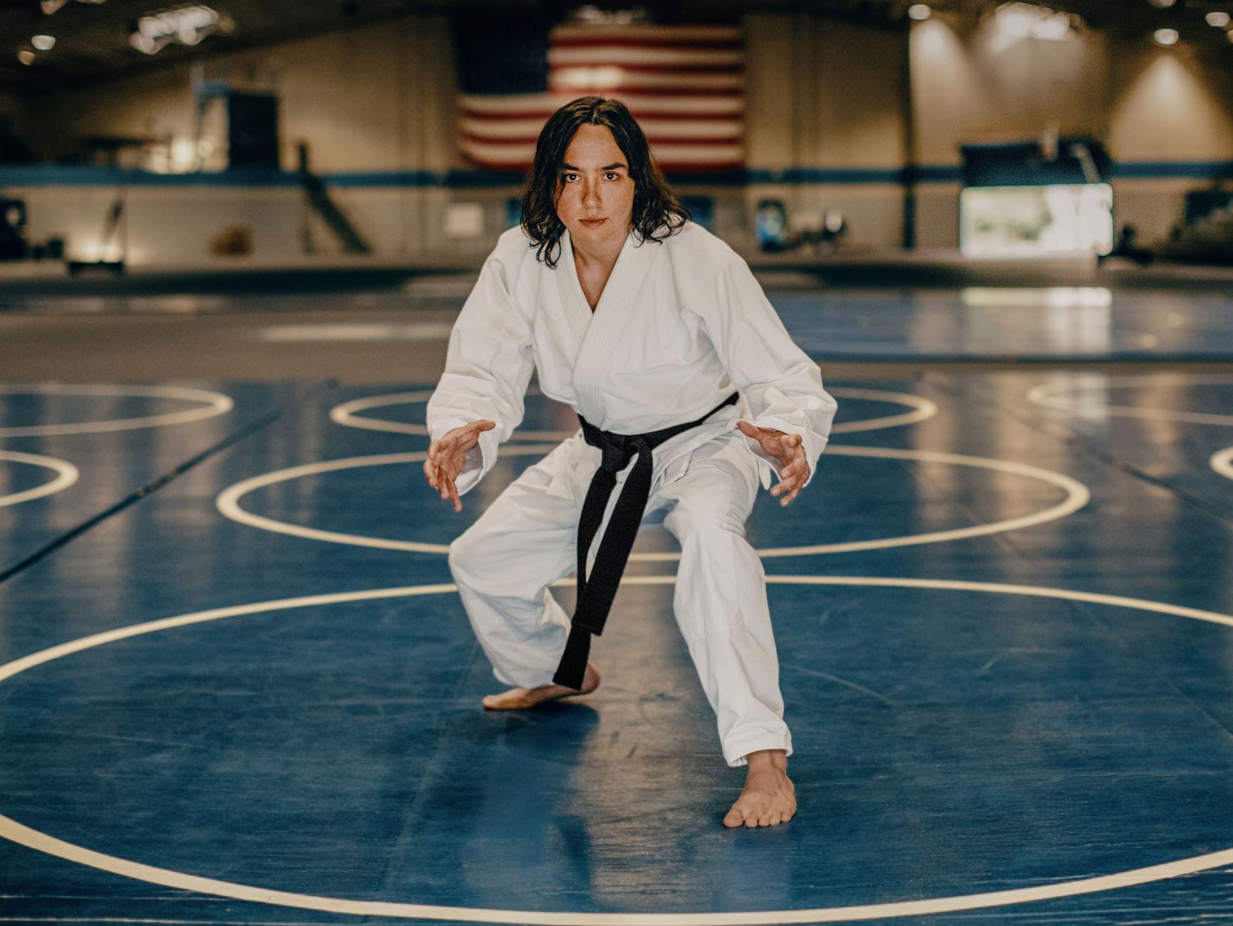 Soldier in a martial arts uniform preparing for a jiu jitsu match