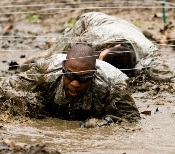 Cadets learn a variety of skills such as over coming an wall obstical as a team.