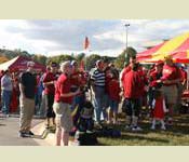 Iowa State University Alumni gather around a tent prior to the kick off of a football game. They exchanged stories and met up with old friends that they had not seen in years. After the tailgate and sharing stories they watched the ISU football team beat up on the West Point football team.