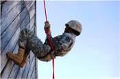 Cadets learn a variety of skills such as rappelling down a high wall.