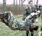 Cadets learn teamwork and to negotiate obstacles by rigging a one-rope-bridge.