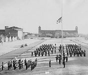 Cadets assemble at the front of campus for the daily flag retreat. This photo depicts what is now the center of campus and the Texas Tech Memorial Circle, a special area on campus honoring Red Raider veterans of foreign wars.