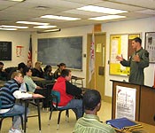 1LT Challen Class of ’03 speaks to a JROTC class.