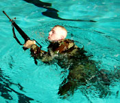 Cadets conduct an annual CWST which consist of: 10 minute swim, 5 minutes of treading water, 15 meter swim in BDUs and with an M16, 3 meter drop, and equipment ditch.