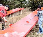 Every year the ROTC Cadets at USD participate in several community service projects including the painting of the giant USD letters outside of Vermillion on the bluffs overlooking the Missouri River. The Prairie Fire Battalion has made the cleaning and painting of the letters an annual event just prior to the homecoming football game each fall.