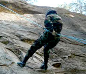 Cadets will conduct a number of confidence building activities during their time in the ROTC program. This cadet is rappelling off the 60 foot cliffs in the mountains.