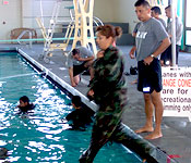 Each semester cadets participate in water survival classes. This includes learning to use the Army Uniform as a floatation device ans well has how to swim with your military equipment. In this photo cadets practice “catching” air in their blouses to act