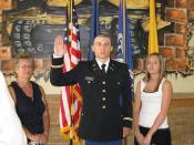 2LT Lipasek is sworn in while his wife and mother look on. This is what ROTC cadets work so hard for; a commission in the United States Army.