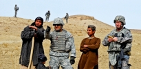 Army soldiers gather intel from an Afghani farmer