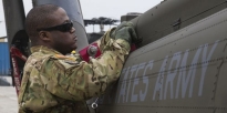 Soldier working on a UH-60 Black Hawk helicopter.