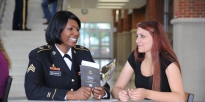 U.S. Army Recruiter talking to a high school student. 